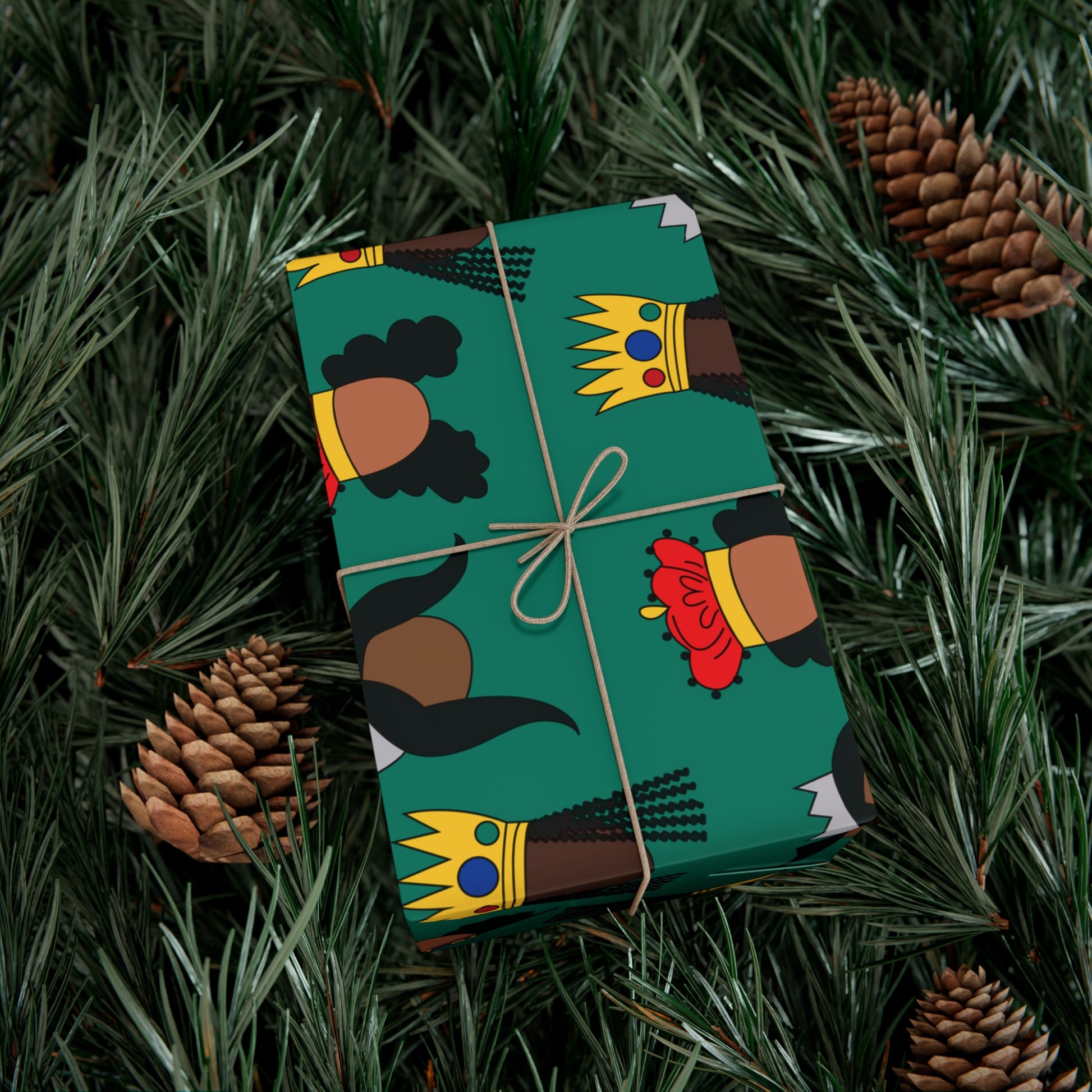 Box wrapped with Black Queens wapping paper on Christmas tree background