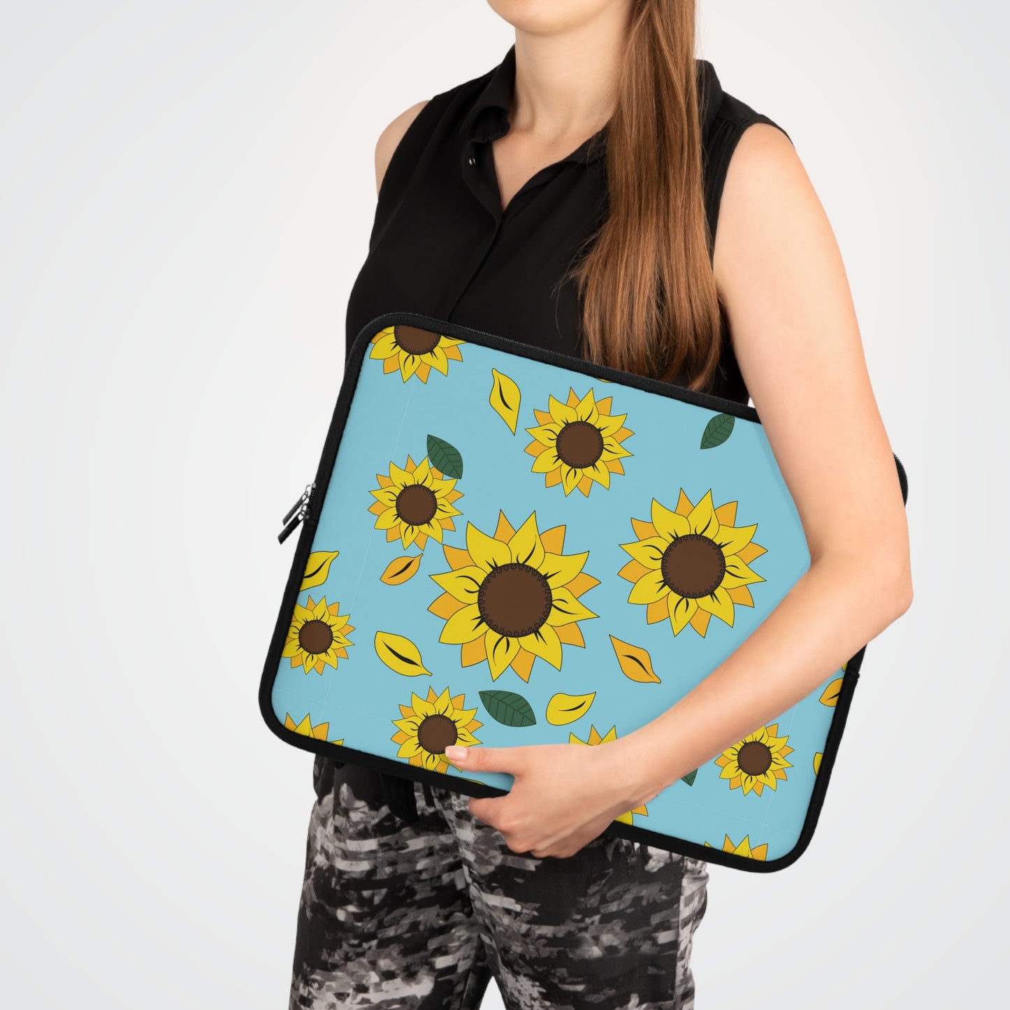  Woman holding her Sunflower patterned laptop sleeve with laptop in it