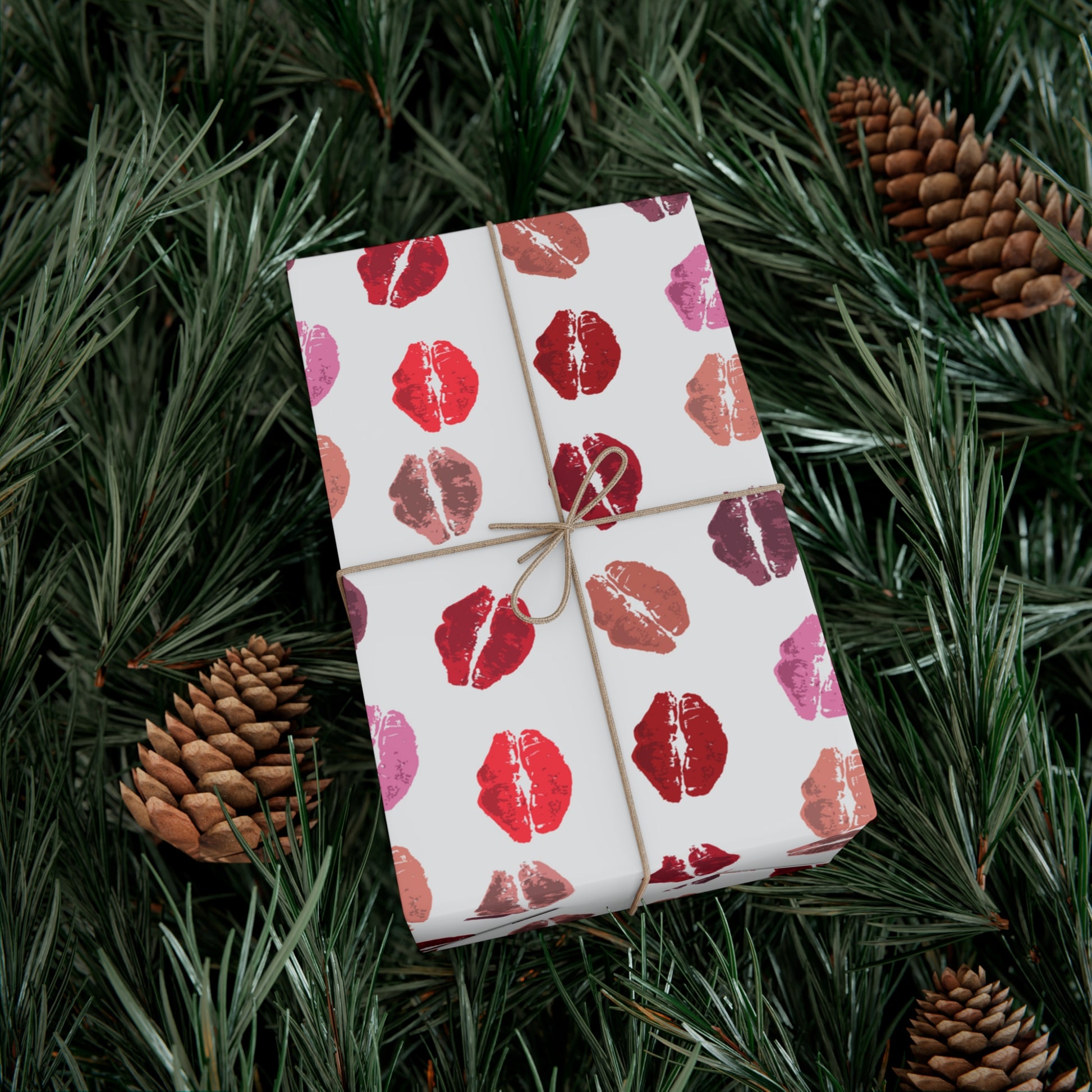 Box wrapped with Kisses from the Misses wrapping paper with Christmas tree background