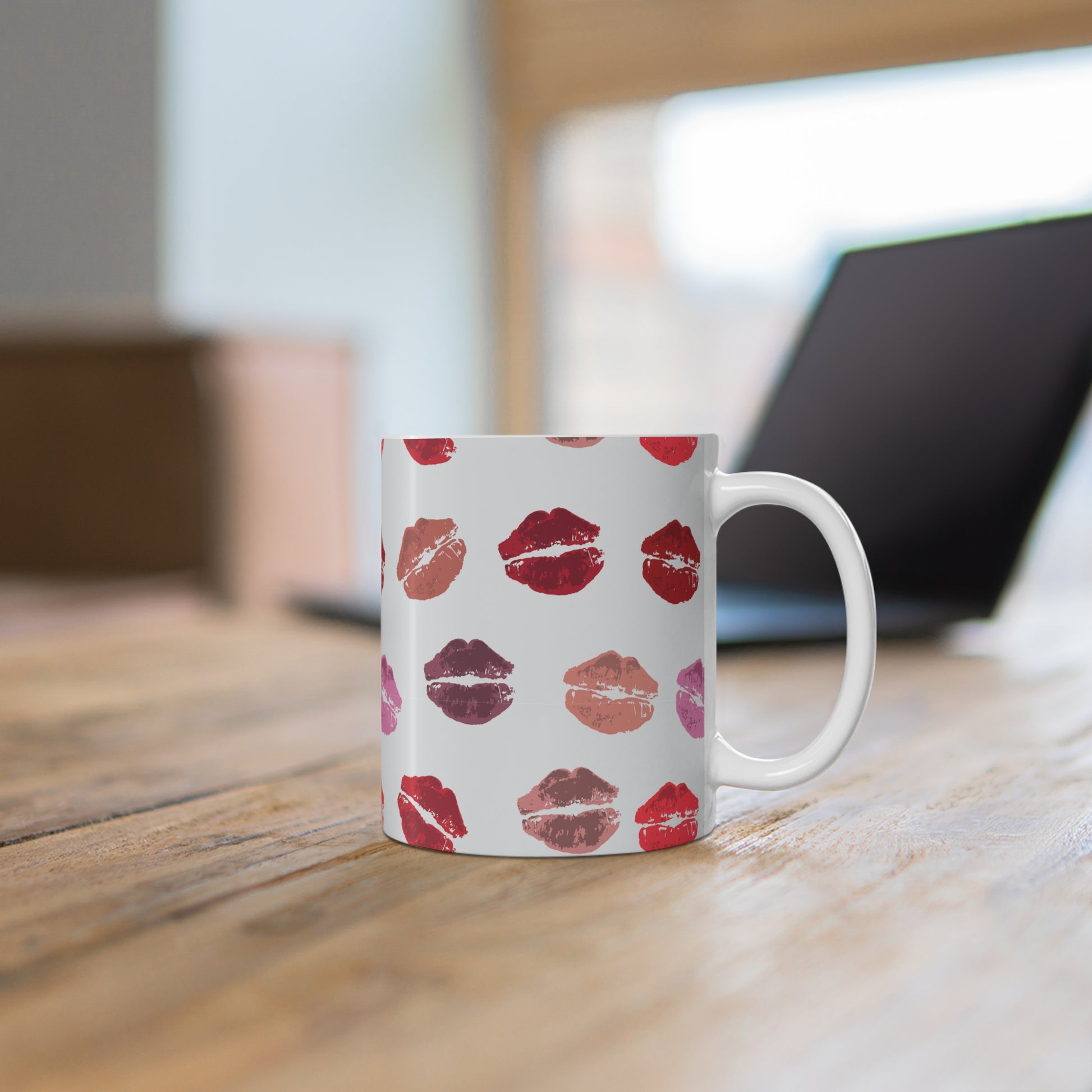 Kisses from the Misses custom patterned mug on a desk