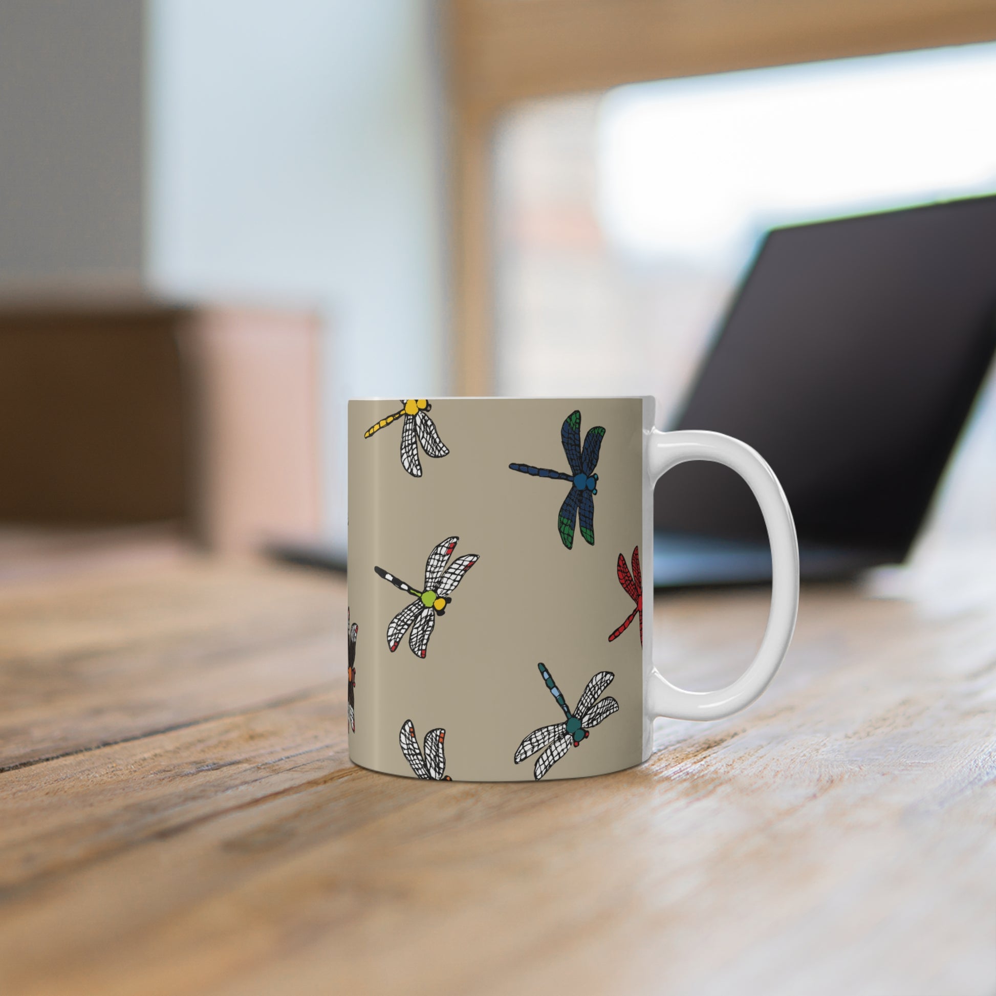 Dragonfly Dandy custom patterned mug on a desk