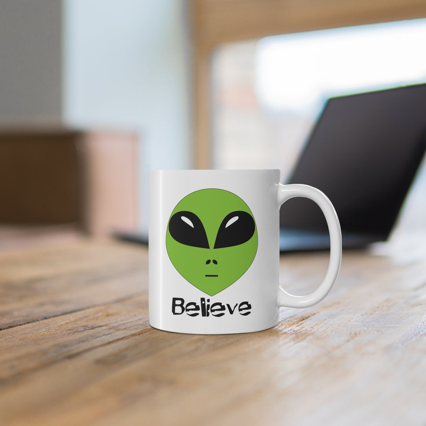 Alien "Believe" mug Alien extraterrestrial mug on a desk