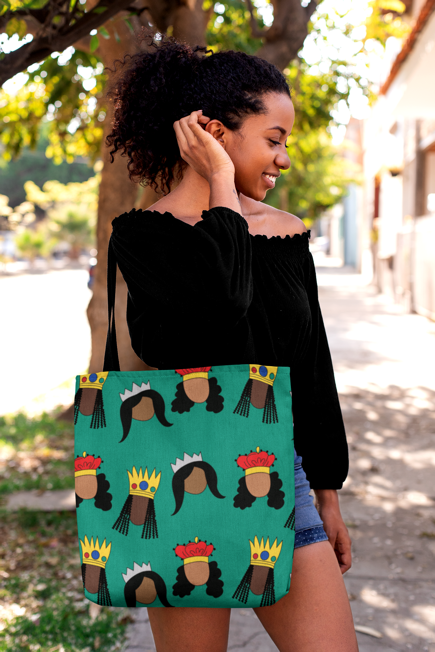 Black woman fixing her hair with Black Queens small print Tote Bag